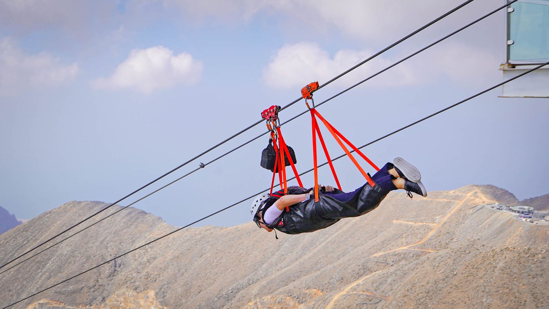 Person enjoying zipline thrill at Jabel Jais